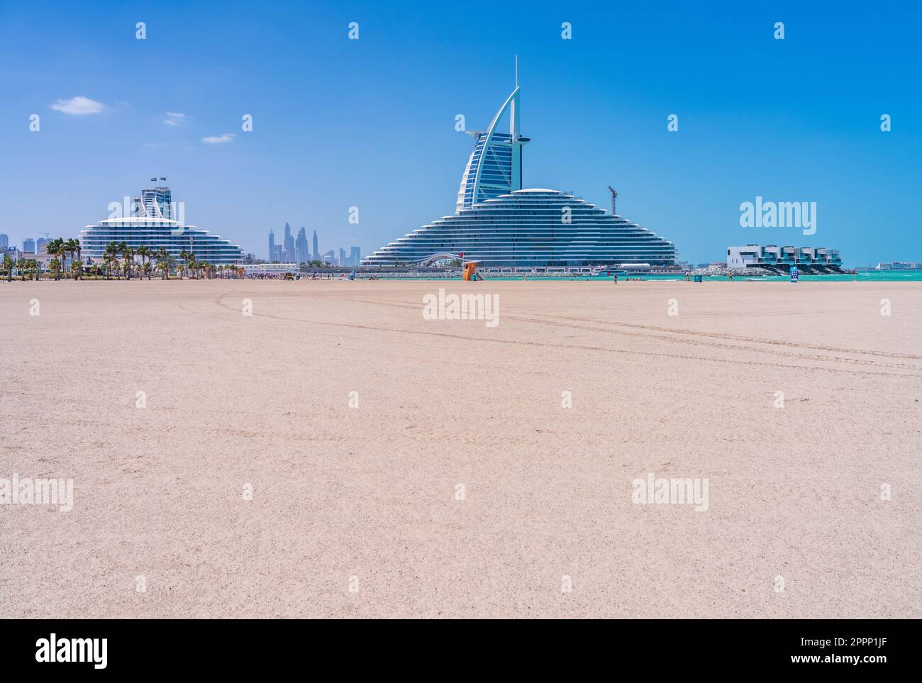 View from Jumeirah public beach of the construction of Marsa al Arab hotel with Burj al Arab behind on coast of Dubai Stock Photo
