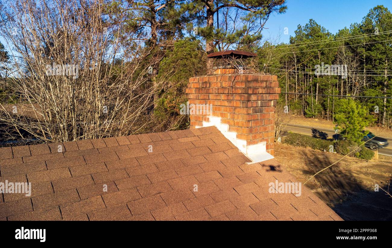 Chimney damaged and in need on maintenance and repair Stock Photo