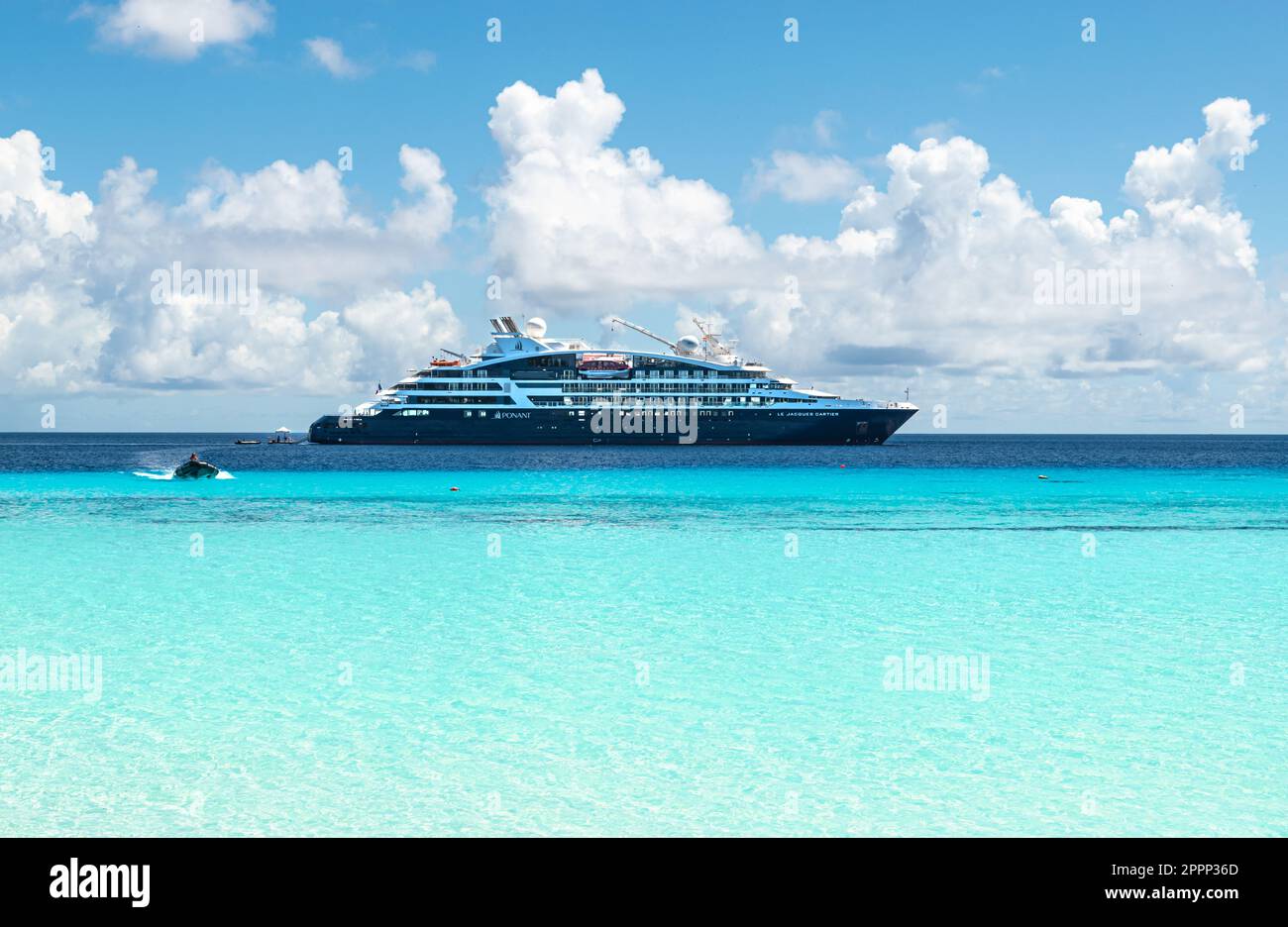 ASSUMPTION ISLAND, SEYCHELLES - MARCH 30, 2023: Expedition Cruise Ship Jacques Cartier of Ponant Cruises anchored at Assumption Island, Seychelles. Stock Photo