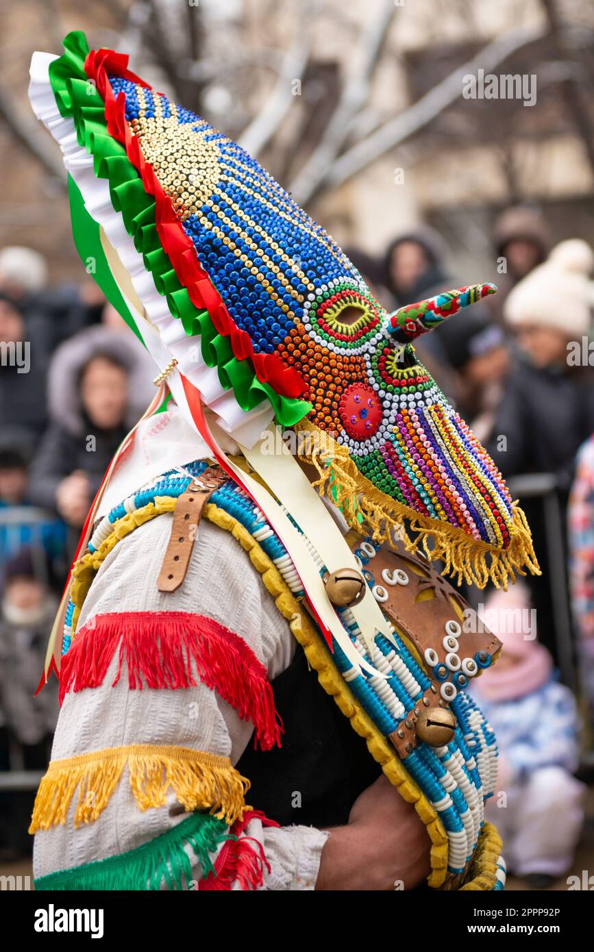 Kukeri dancer wearing intricate mask and costume at the Surva International Masquerade and Mummers Festival in Pernik, Bulgaria, Eastern Europe, Balka Stock Photo