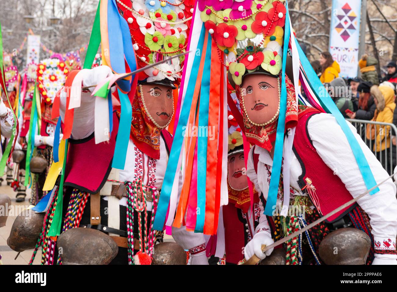 Kukeri dancers with colorful masks from Central Bulgaria called Startsi at the Surva International Masquerade and Mummers Festival in Pernik, Sofia Re Stock Photo