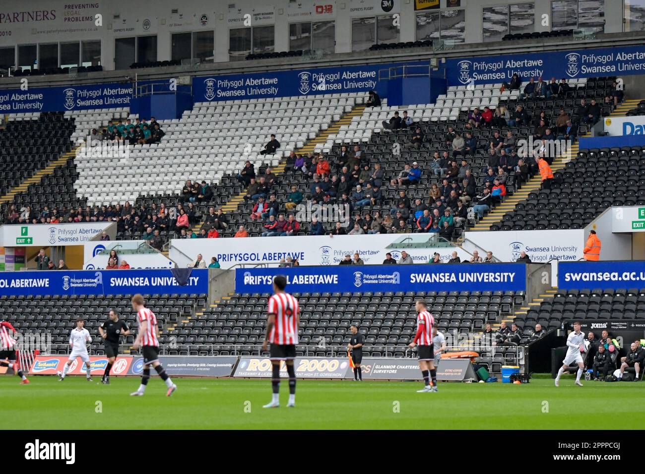 Swansea, Wales. 24 April 2023. Swansea City fans during the Professional Development League game between Swansea City Under 21 and Sheffield United Under 21 at the Swansea.com Stadium in Swansea, Wales, UK on 24 April 2023. Credit: Duncan Thomas/Majestic Media/Alamy Live News. Stock Photo