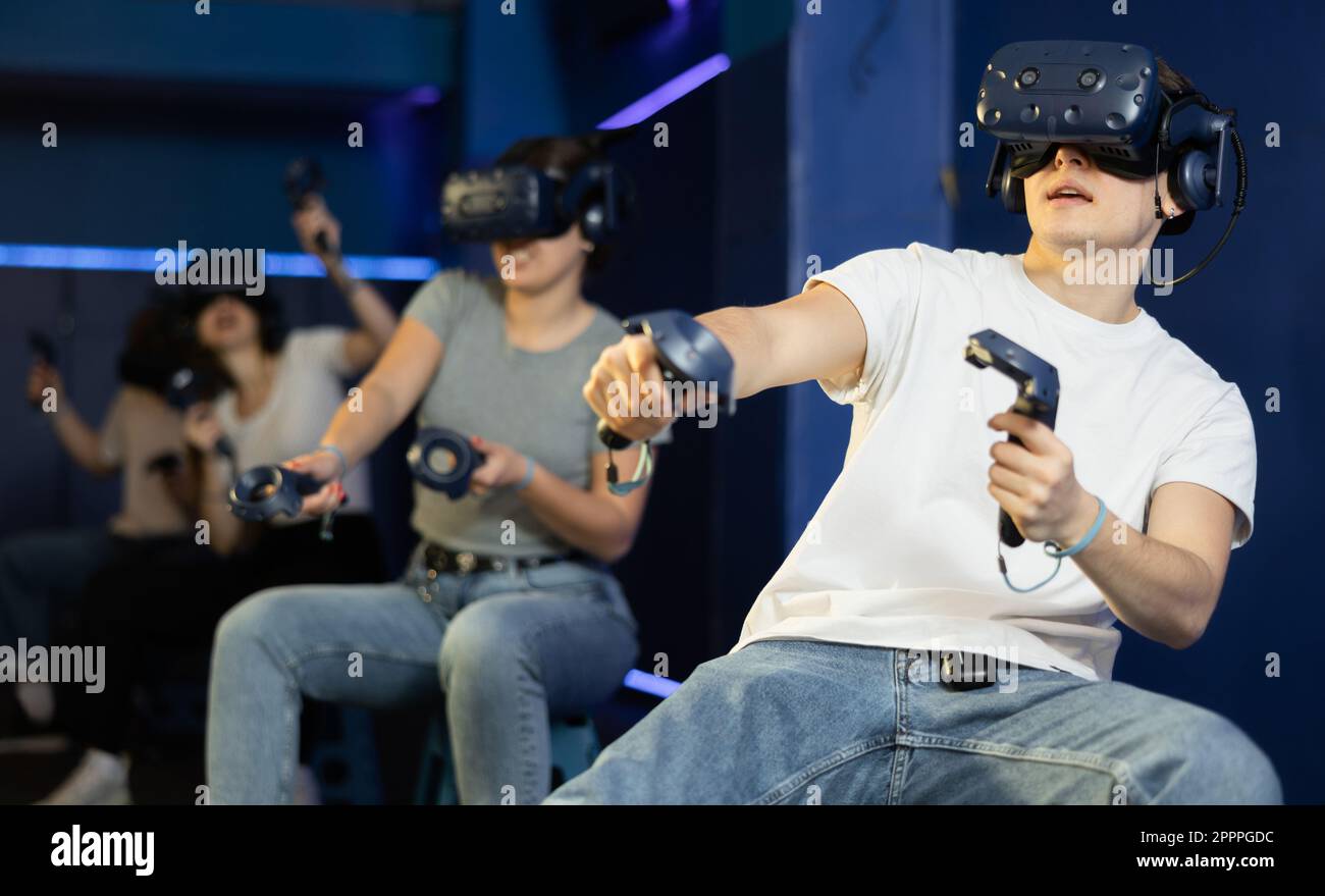 Man In Virtual Reality Glasses Controls Superhero With Joystick In man-in-virtual-reality-glasses-controls-superhero-with-joystick-in