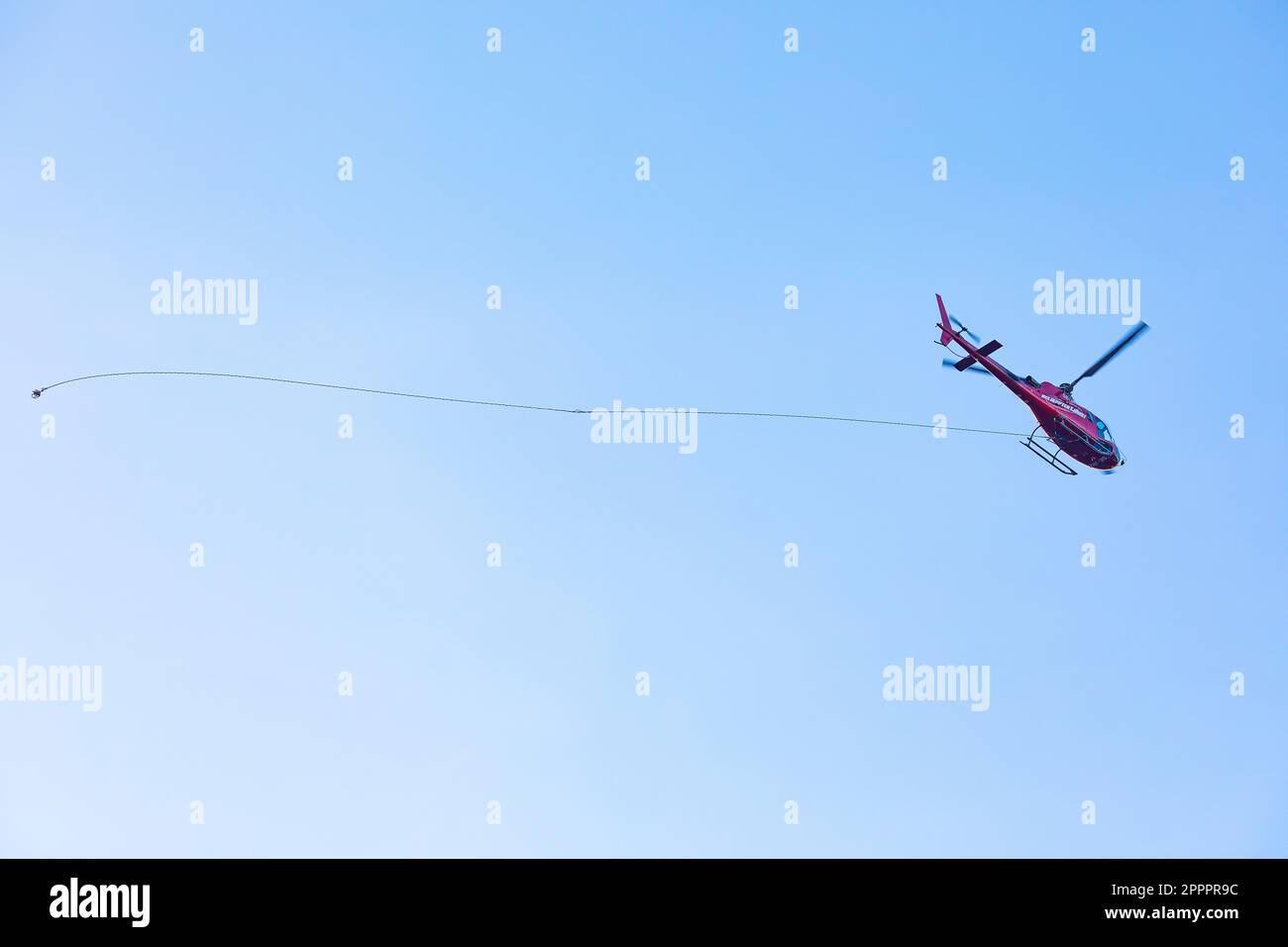 Helicopter with string line Stock Photo