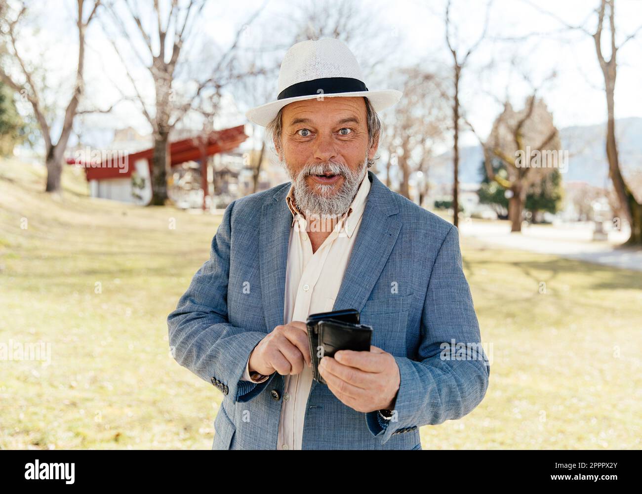 Portrait of a confident, handsome, mature man, pensioner, grandfather in the small town Stock Photo