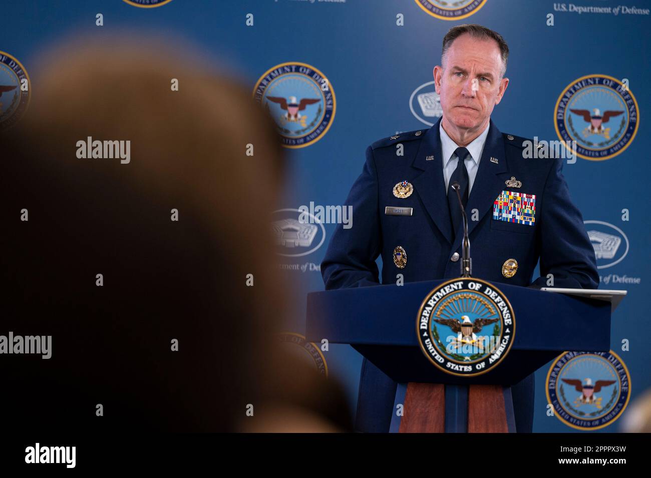 Arlington, United States Of America. 24th Apr, 2023. Arlington, United States of America. 24 April, 2023. Pentagon Press Secretary Air Force Brig. Gen. Pat Ryder listens to a question from a reporter during a press briefing at the Pentagon, April 24, 2023 in Arlington, Virginia. Ryder announced that Arleigh Burke-class guided-missile destroyer USS Truxtun is off the coast of Sudan following the evacuation of the U.S. Embassy in Khartoum. Credit: MC2 Alexander Kubitza/DOD/Alamy Live News Stock Photo