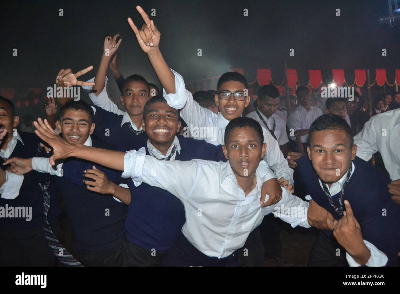 Cadets are celebrating and enjoying their night party with dancing. Stock Photo