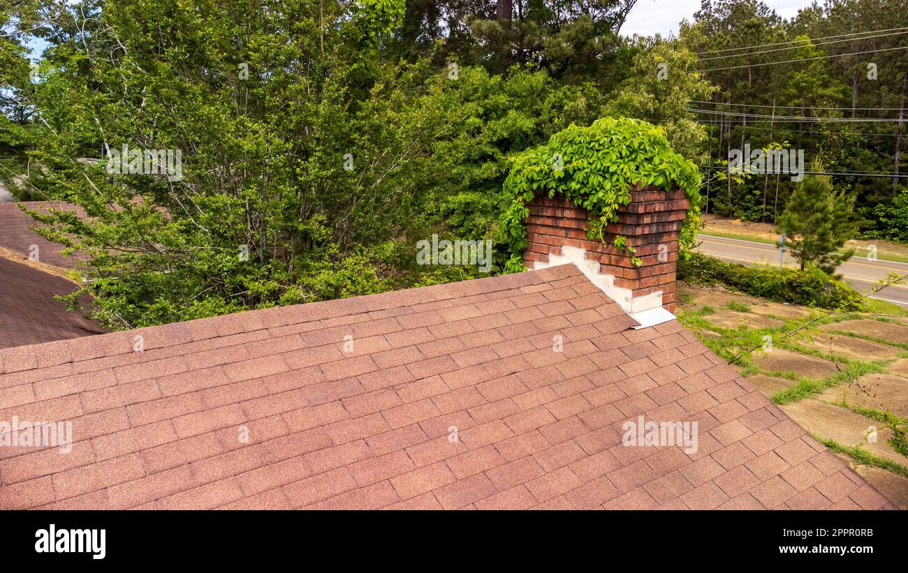 Chimney damaged and in need on maintenance and repair Stock Photo