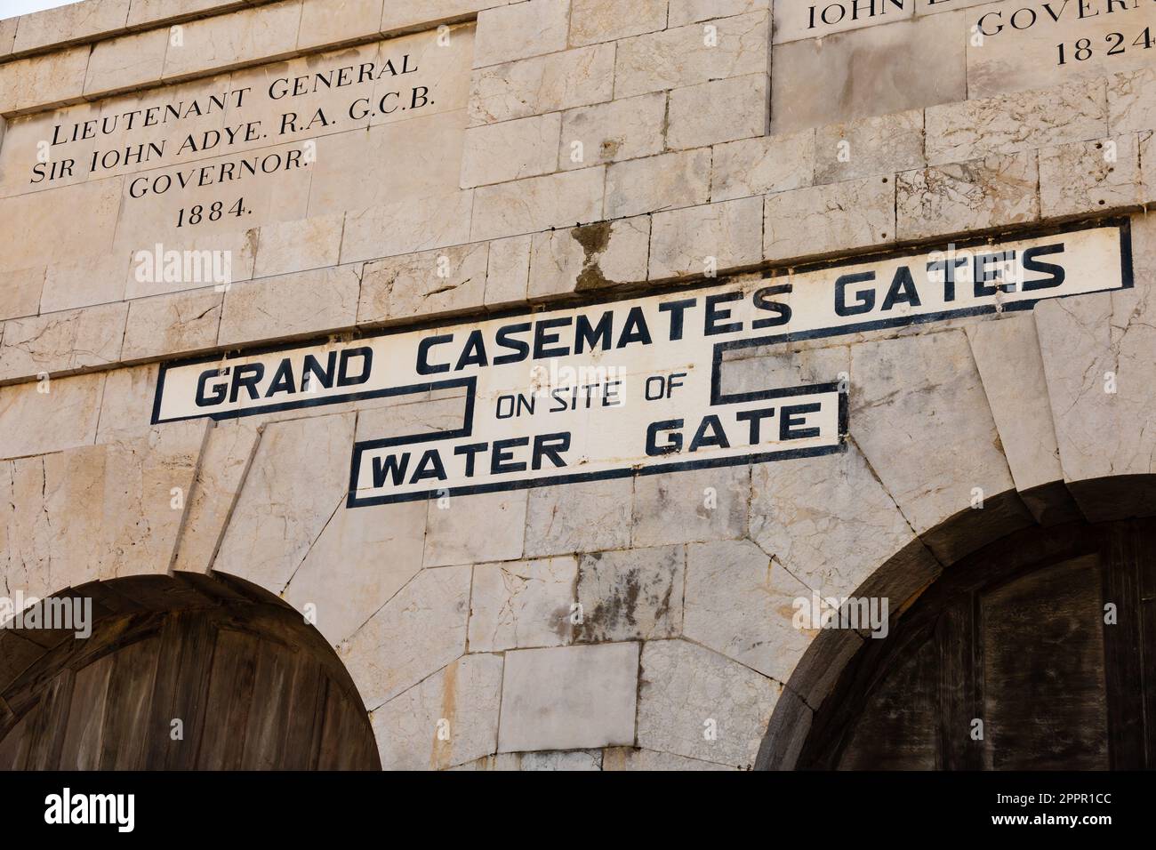 Line curtain wall entrance to Grand Casemates Square, Grand Casemates Gate, formerly Waterport Gate and Water Gate. Inscribed with Sir Iohn Adye, Gove Stock Photo
