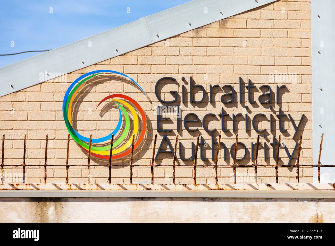 Gibraltar Electricity Authority logo on building. North Mole road, The British Overseas Territory of Gibraltar, the Rock of Gibraltar on the Iberian P Stock Photo