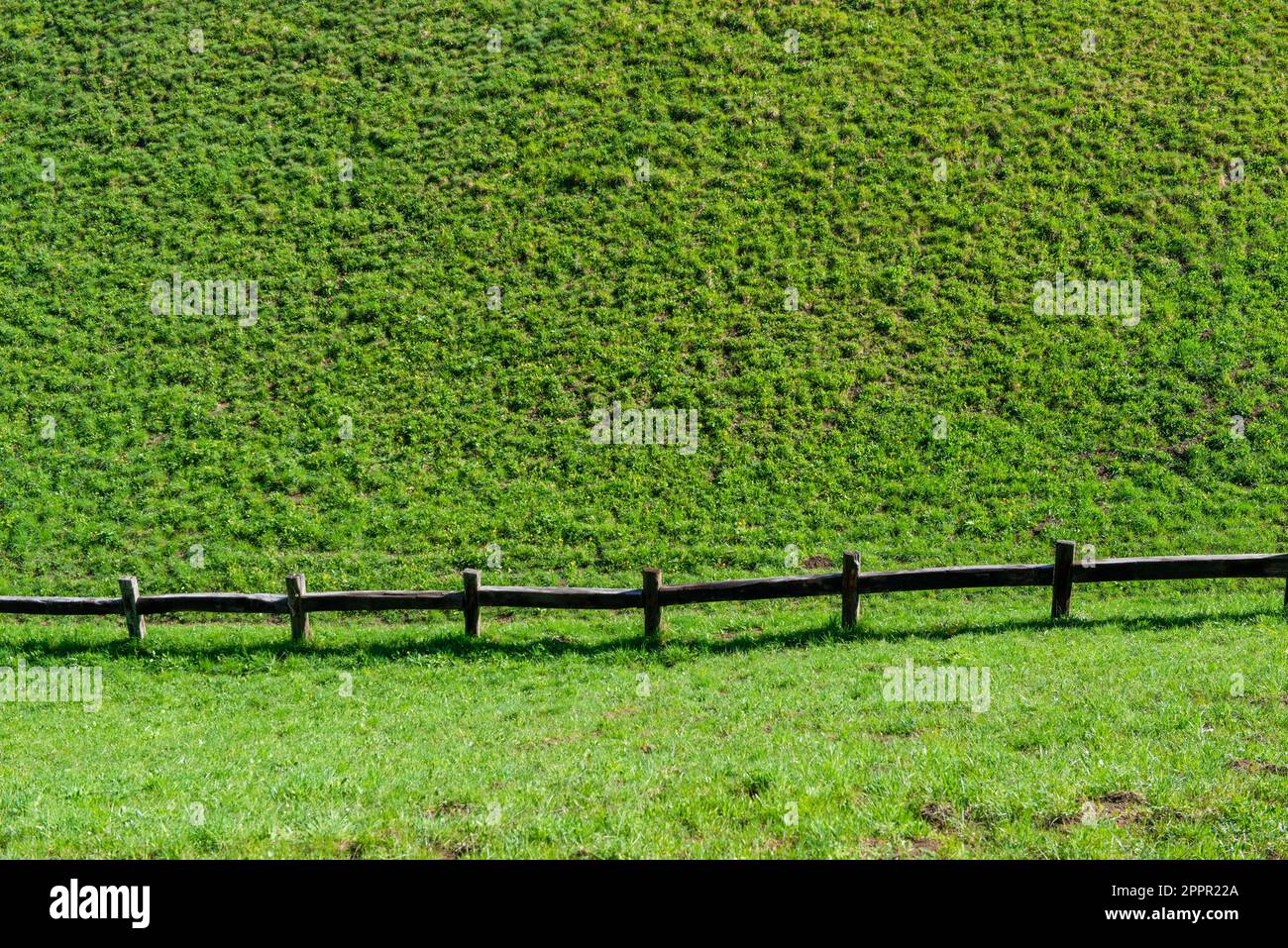 Fence that delimits the border between one agricultural property and another Stock Photo