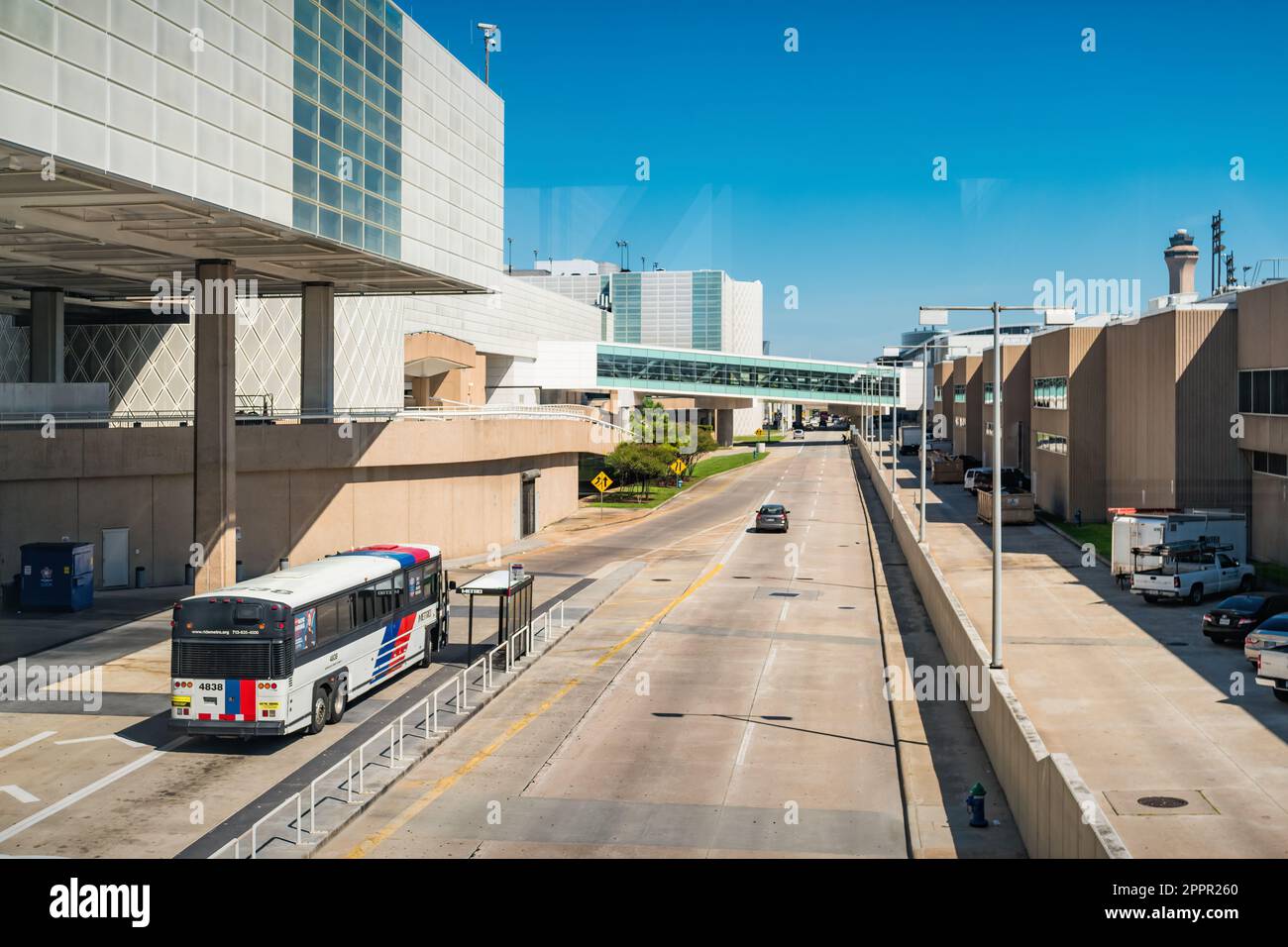 Bus stands at a bus stop at George Bush Intercontinental Airport in Houston, Texas, USA. Stock Photo