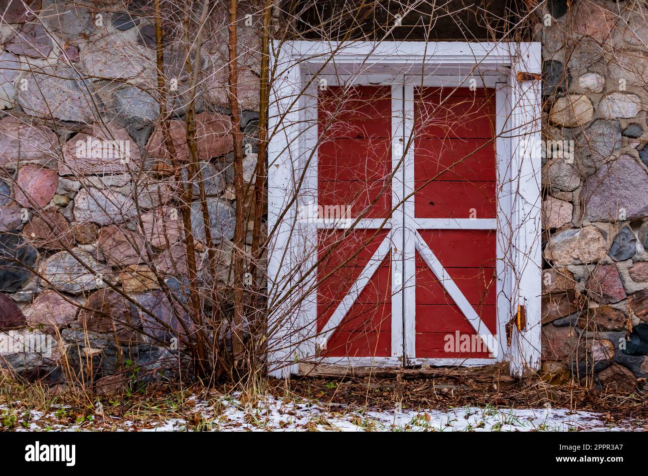 Door into old stone building on private property along White Pine Trail State Park in Central Michigan, USA [No property release; editorial licensing Stock Photo