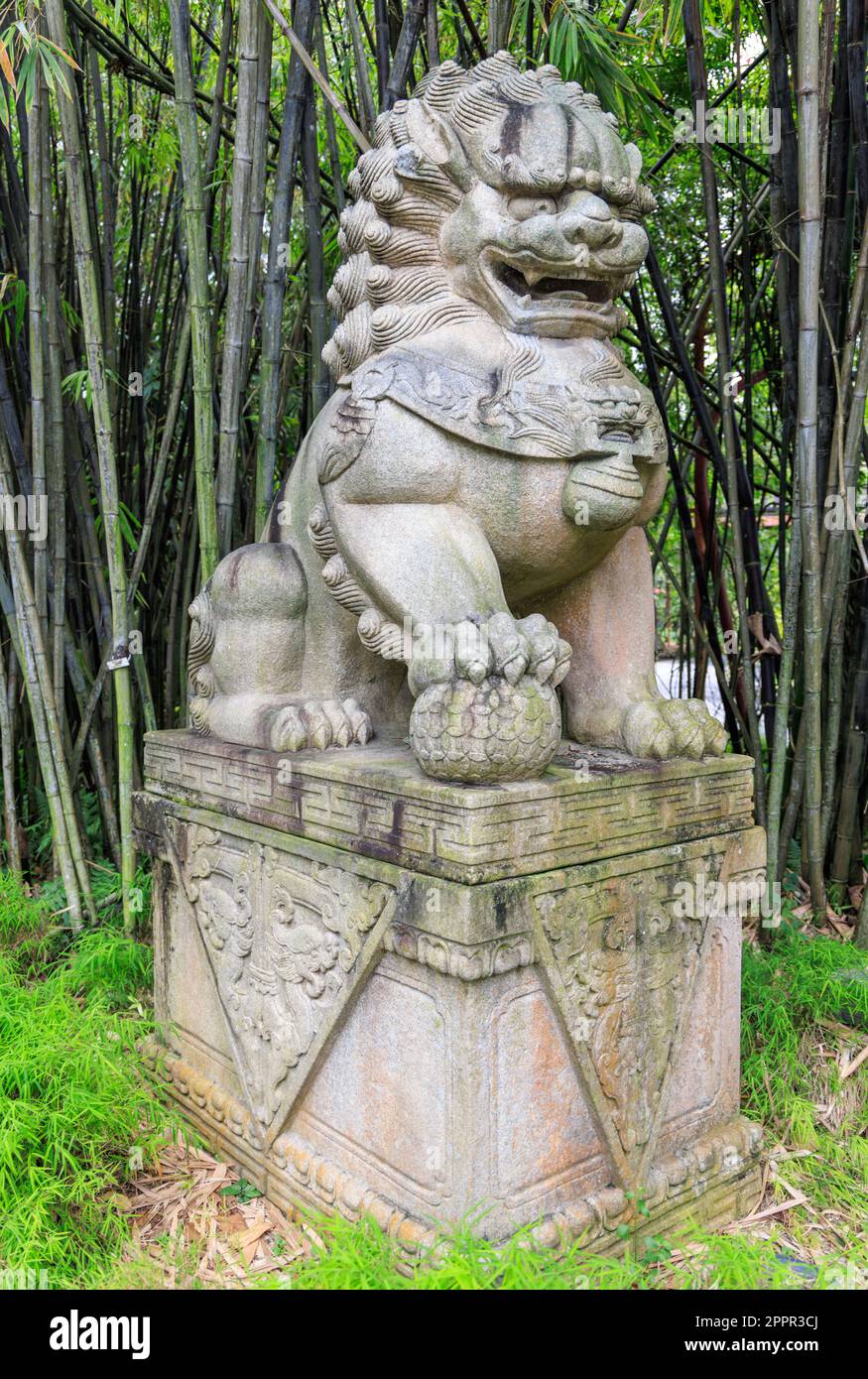 Stone male guardian lion statue in Gardens by the Bay, Singapore Stock
