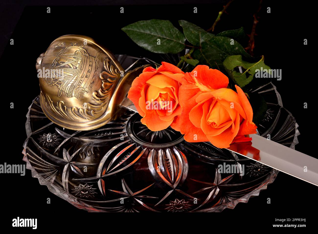 Cutlass and roses isolated over a black background Stock Photo - Alamy