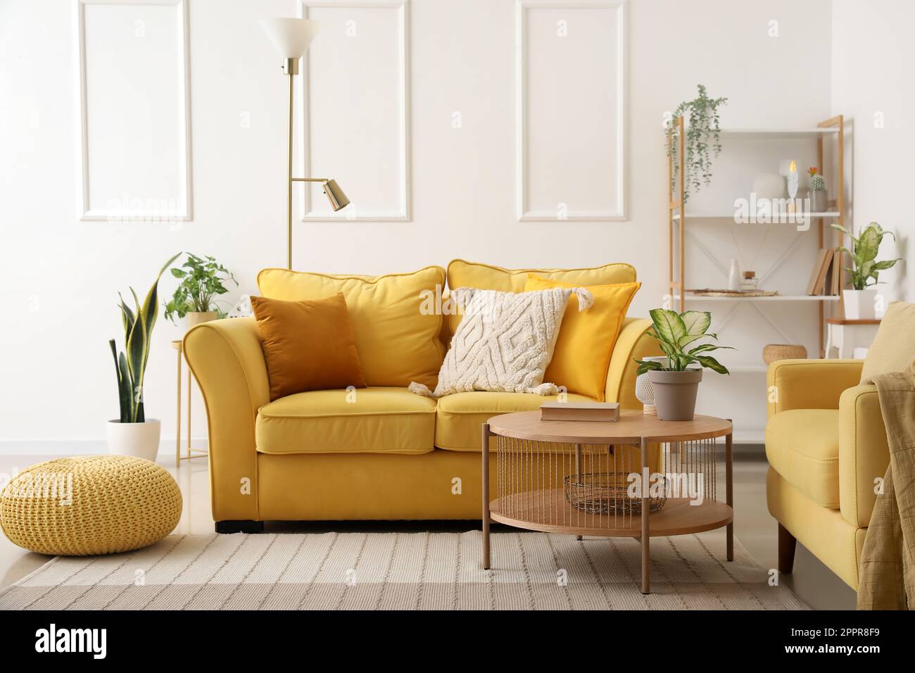 Interior of stylish living room with cozy sofa, armchair and coffee ...