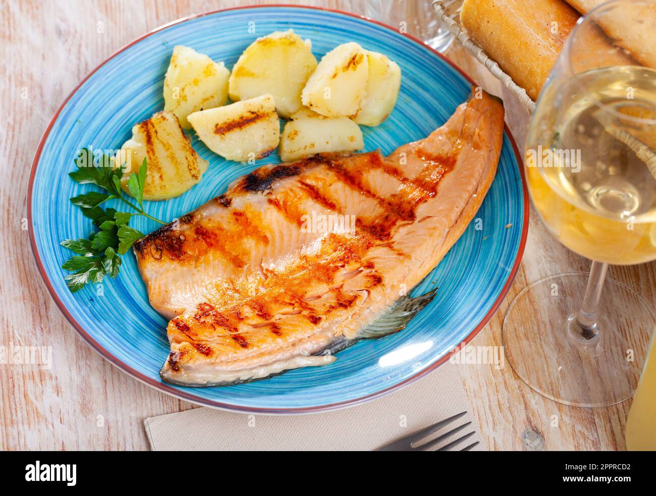 Roasted trout fillet with potatoes Stock Photo Alamy