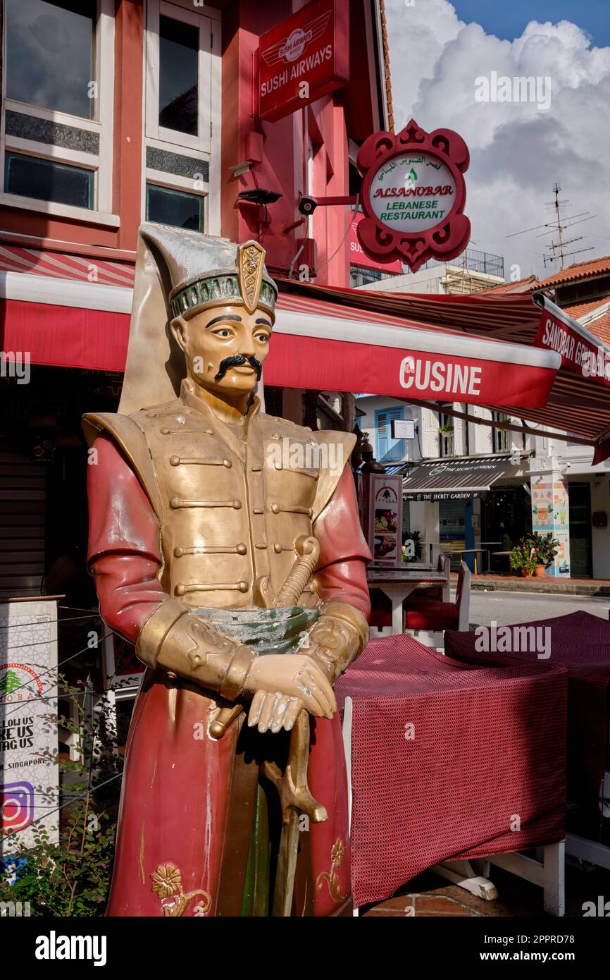 Statue of an Arab soldier with sword outside of Al Sanobar Restaurant, Baghdad Street, Kampong Glam, Singapore Stock Photo