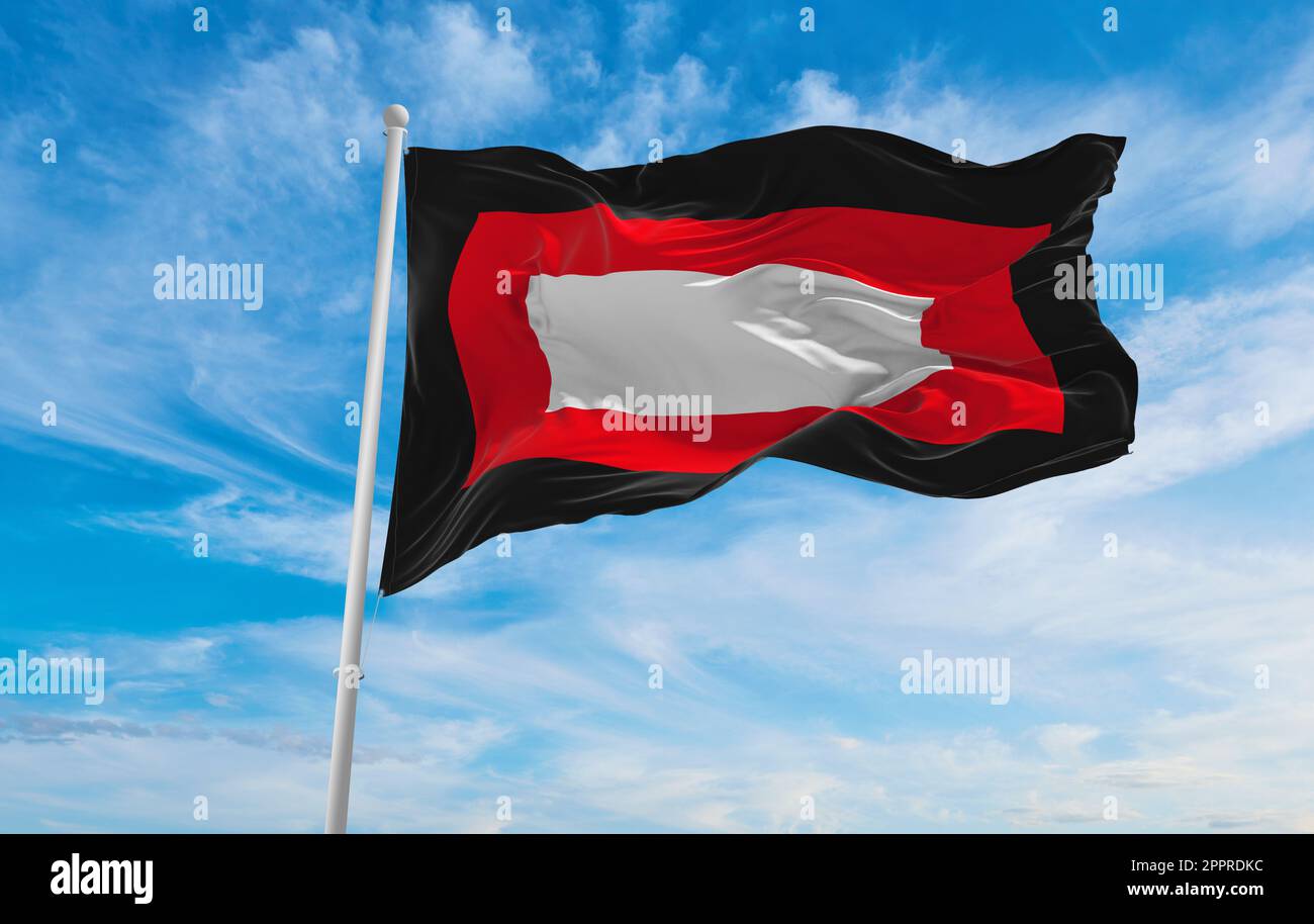 flag of Dutch Creole peoples Baster at cloudy sky background, panoramic