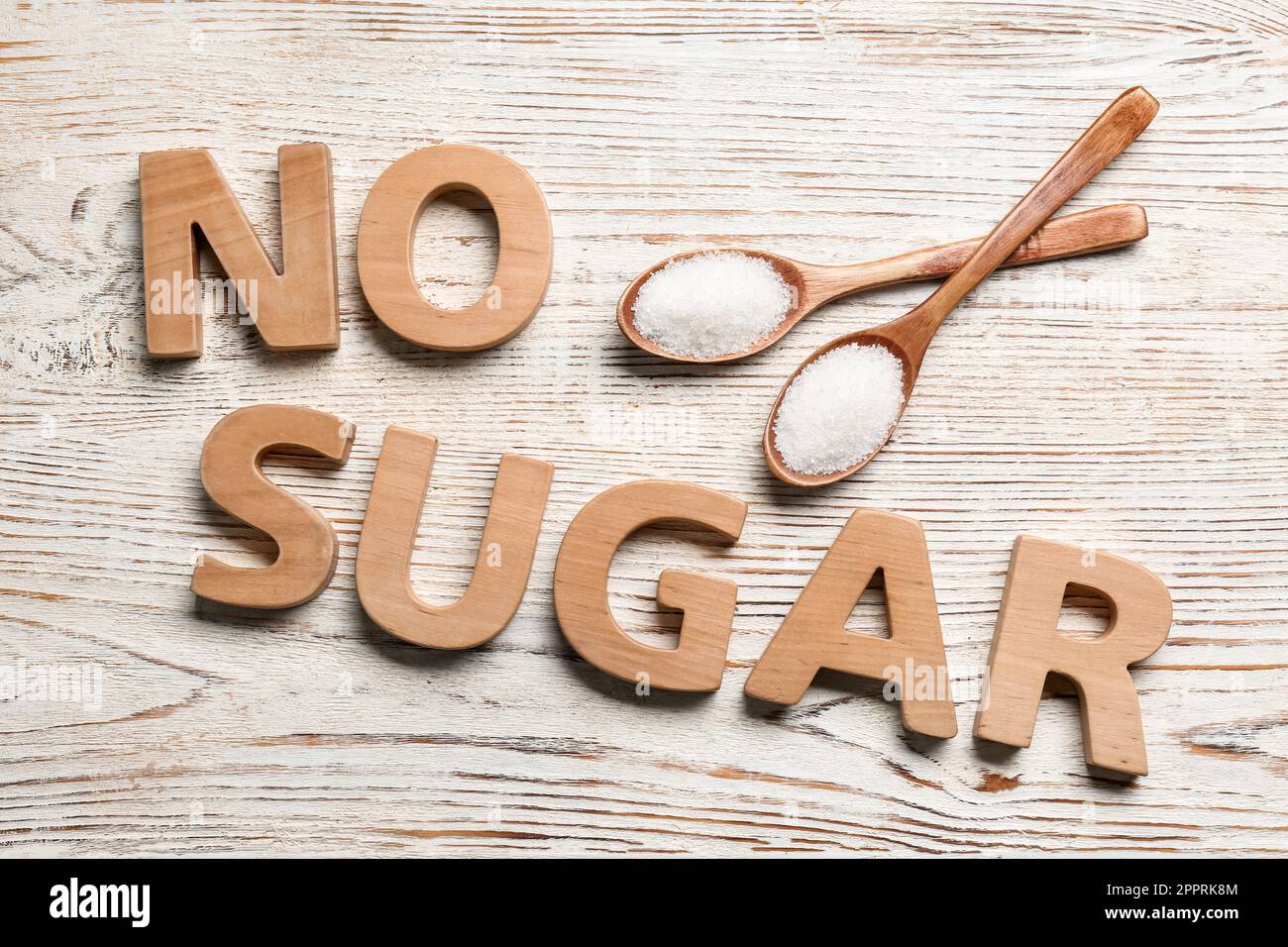 Flat lay composition with phrase No Sugar on white wooden table Stock Photo