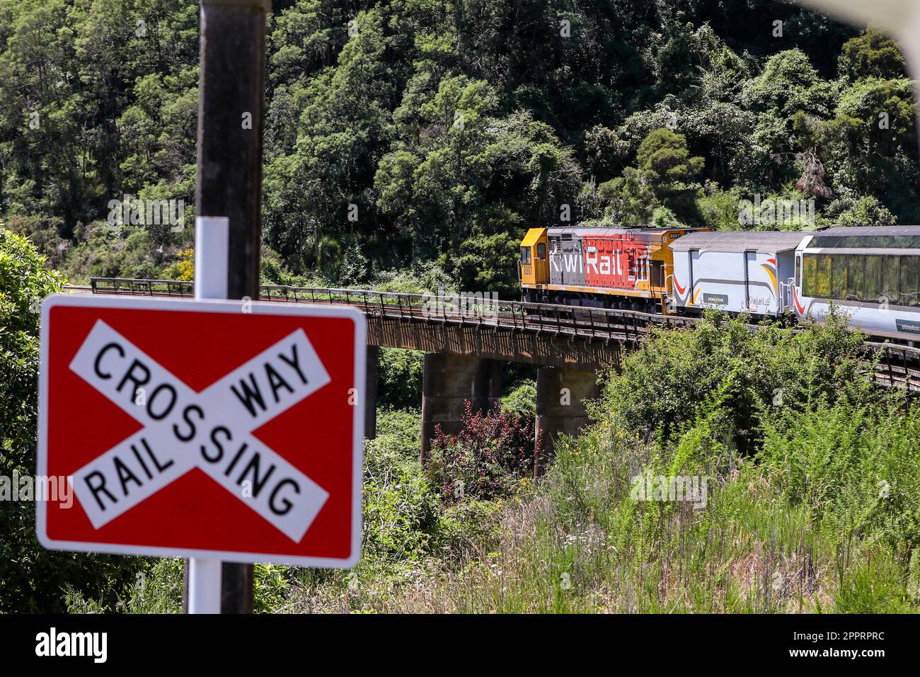 A KiwiRail passenger train from Christchurch plies the rugged Coastal