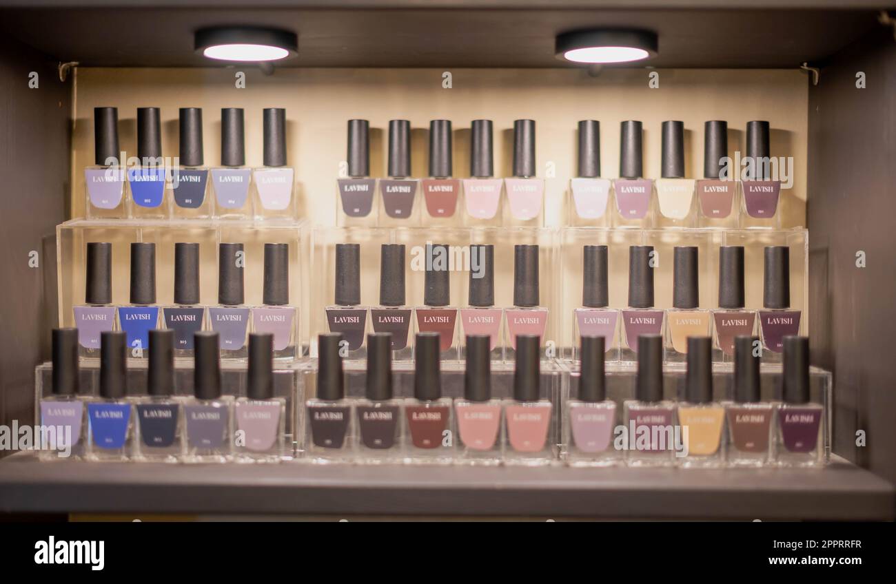 Bottles of colorful nail polish, nail art colors at the nail shop and beauty salon. Stock Photo