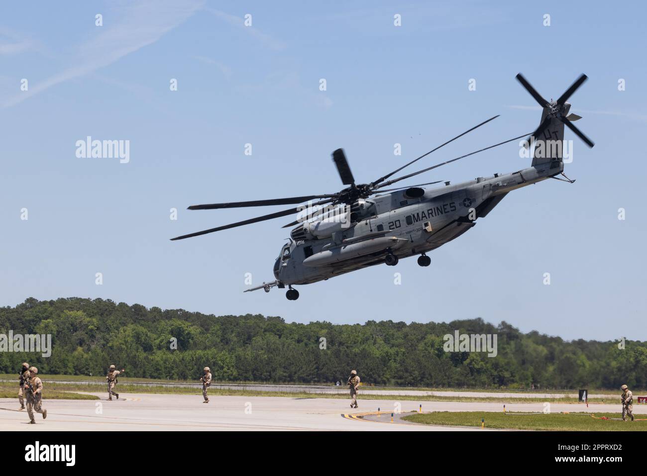 A U.S. Marine Corps CH-53E Super Stallion with Marine Heavy Helicopter Training Squadron 302, 2nd Marine Aircraft Wing, participates in the Marine Marine Air-Ground Task Force (MAGTF) demonstration during the 2023 Beaufort Airshow at Marine Corps Air Station (MCAS) Beaufort, South Carolina, April 23, 2023. The MAGTF is combined of four elements: Command Element, Ground Combat Element, Aviation Combat Element and Logistics Combat Element that work seamlessly together. Within days, a MAGTF can be anywhere in the world and arrive ready to accomplish its mission. The MAGTF is the ideal rapid respo Stock Photo