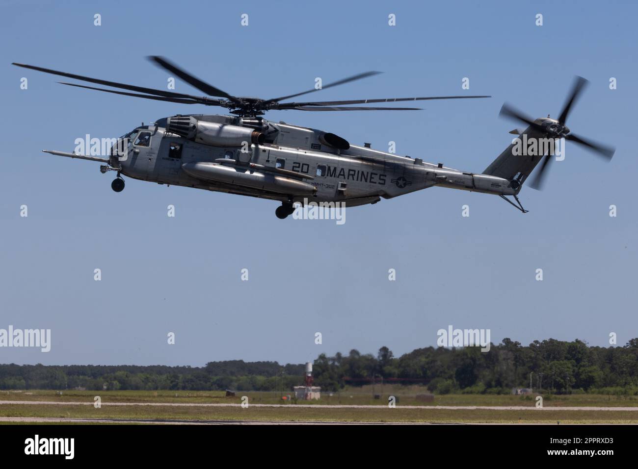 A U.S. Marine Corps CH-53E Super Stallion with Marine Heavy Helicopter Training Squadron 302, 2nd Marine Aircraft Wing, participates in the Marine Marine Air-Ground Task Force (MAGTF) demonstration during the 2023 Beaufort Airshow at Marine Corps Air Station (MCAS) Beaufort, South Carolina, April 23, 2023. The MAGTF is combined of four elements: Command Element, Ground Combat Element, Aviation Combat Element and Logistics Combat Element that work seamlessly together. Within days, a MAGTF can be anywhere in the world and arrive ready to accomplish its mission. The MAGTF is the ideal rapid respo Stock Photo