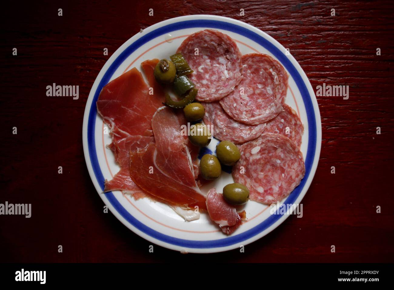 Spanish jamon serrano ham, olives and salami in a home in Queretaro