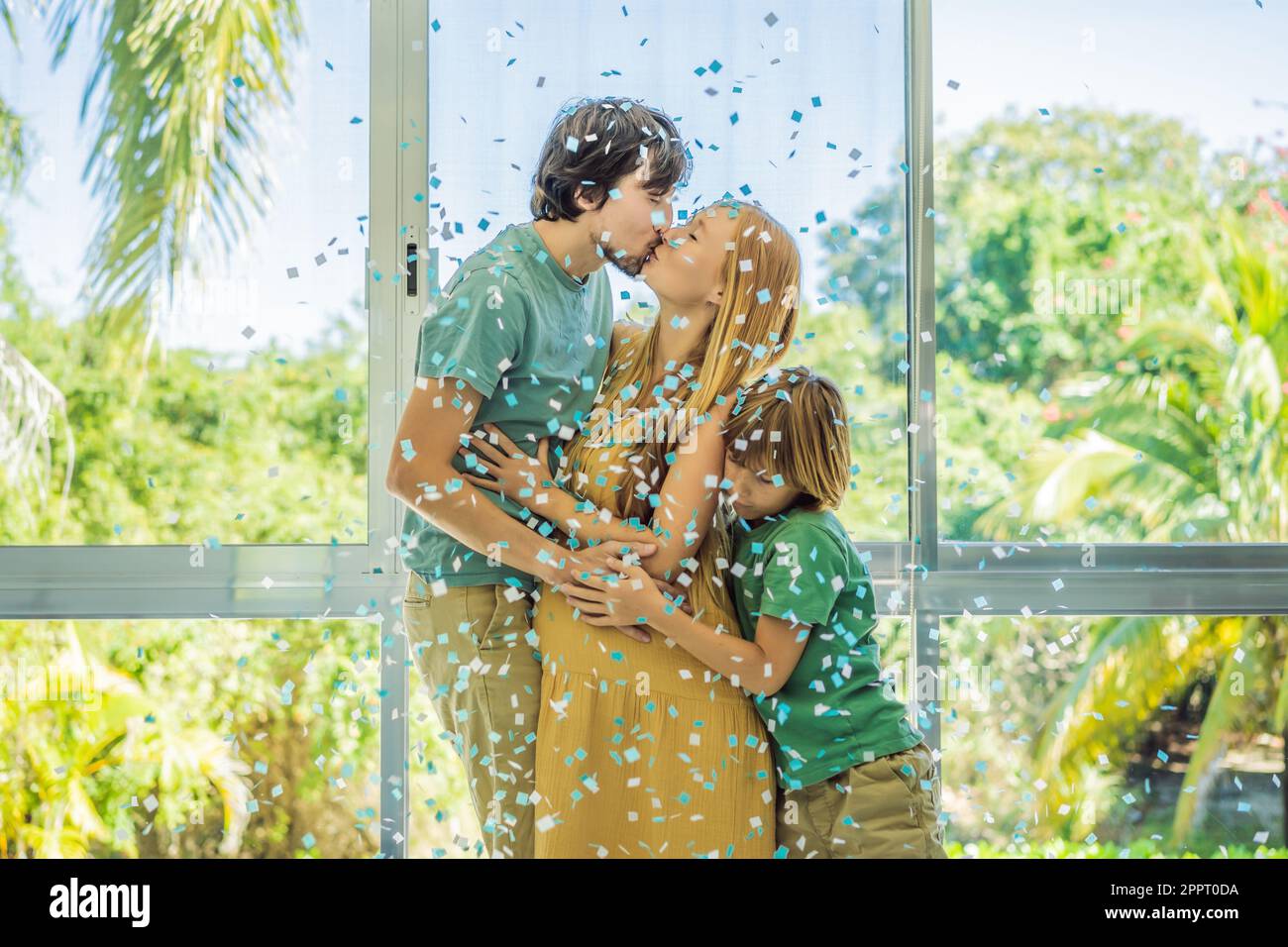 It's a boy. Expectant parents mother, father and their elder son are ...