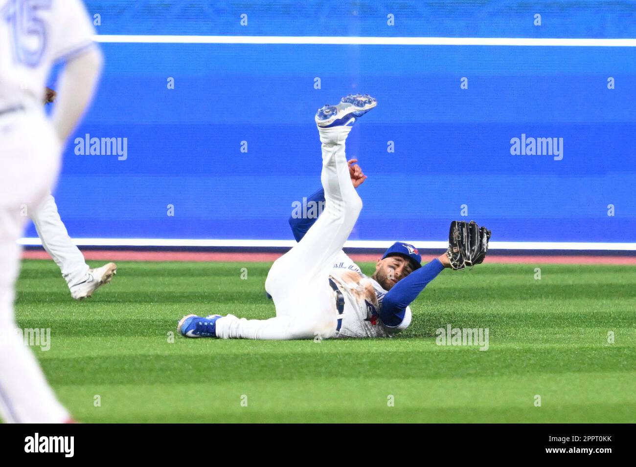 TORONTO, ON - APRIL 24: Toronto Blue Jays left fielder Daulton Varsho (25)  makes the sliding catch in the outfield during the MLB regular season game  between the Chicago White Socks and