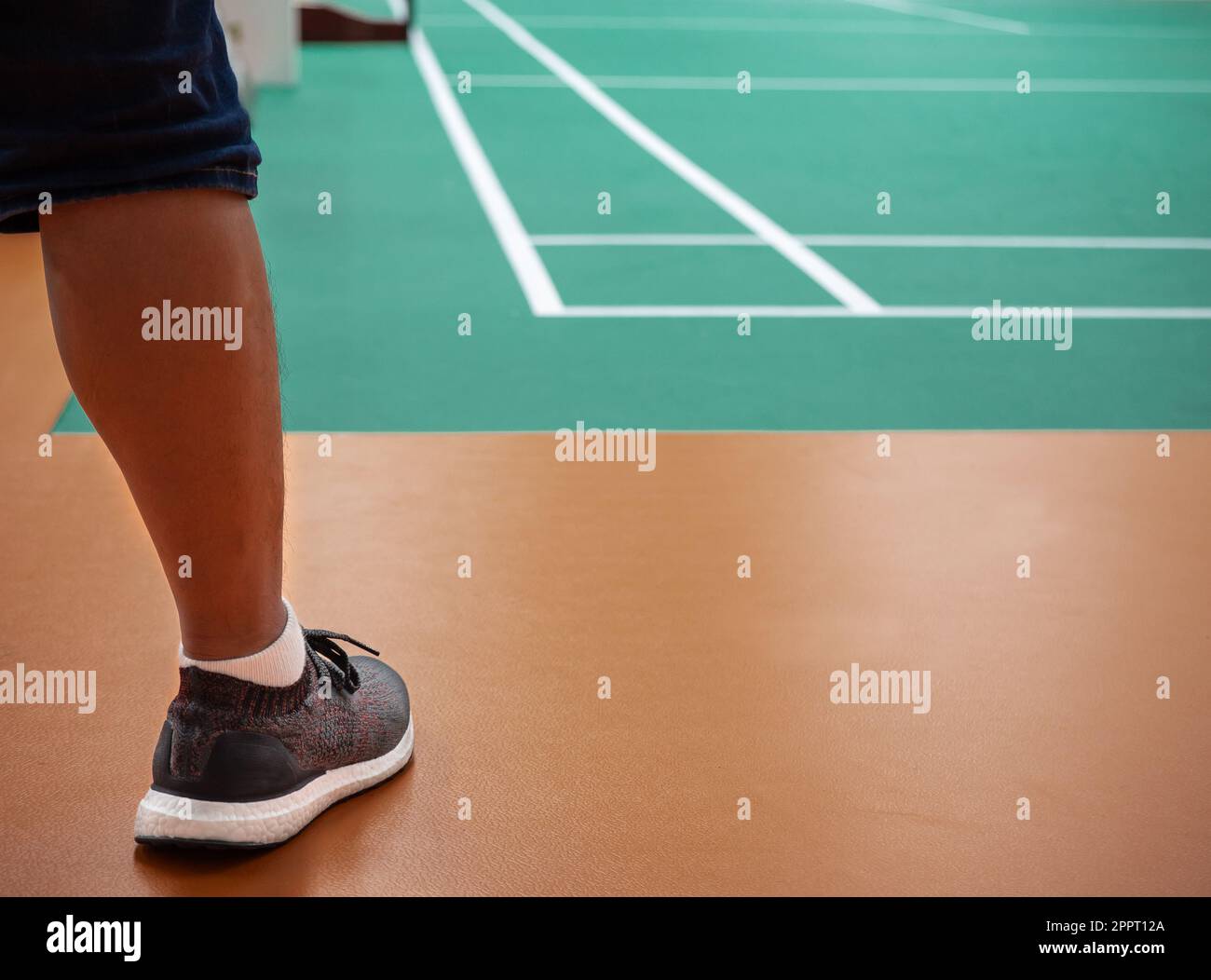 Indoor badminton court with the player leg , selective focus Stock