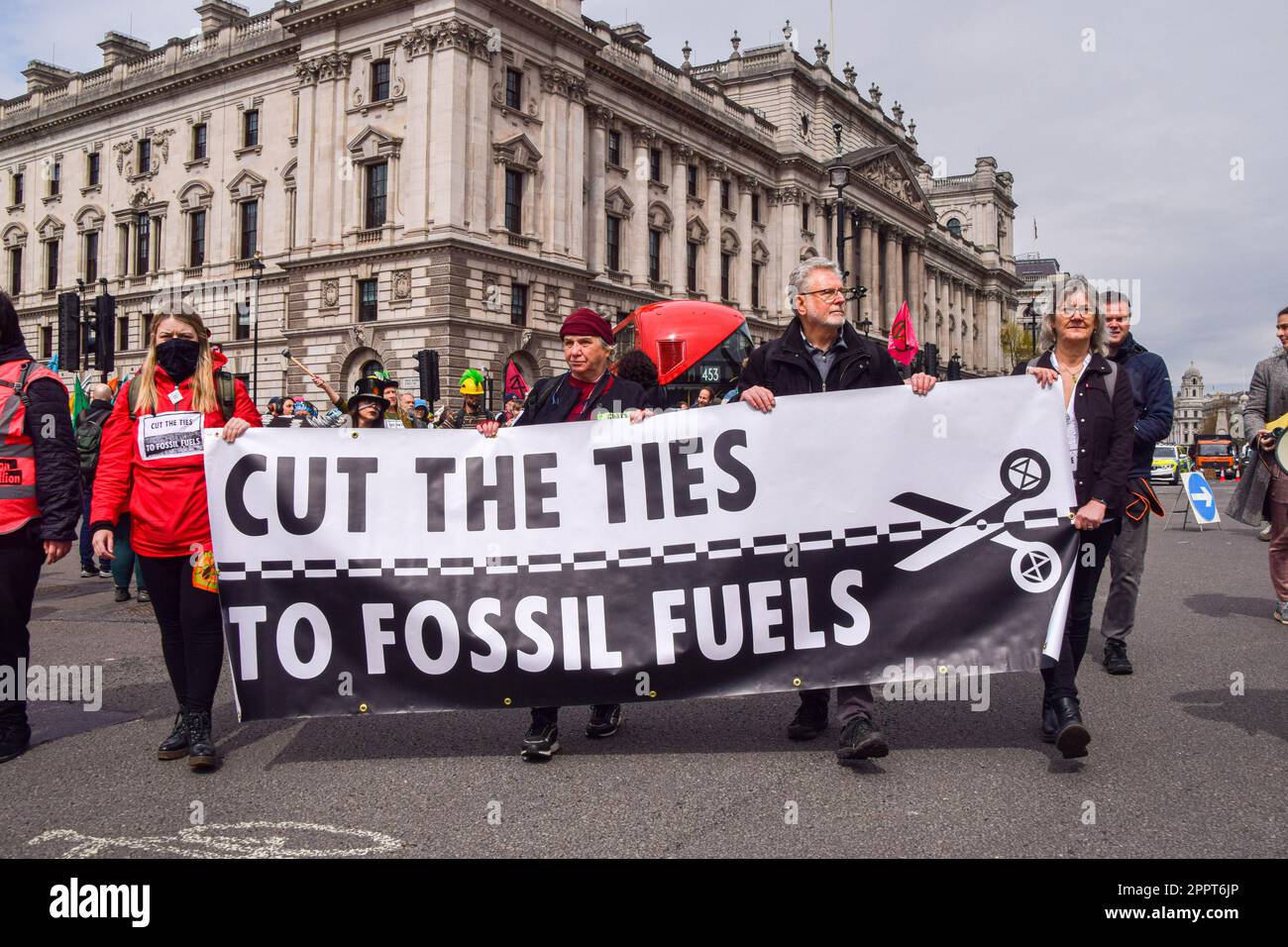 London, UK. 24th Apr, 2023. Protesters hold an antifossil fuel banner