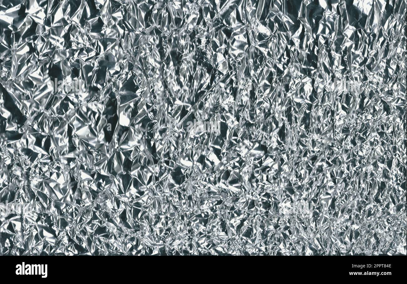 Silver foil texture background, crumpled silver foil texture. Stock Photo