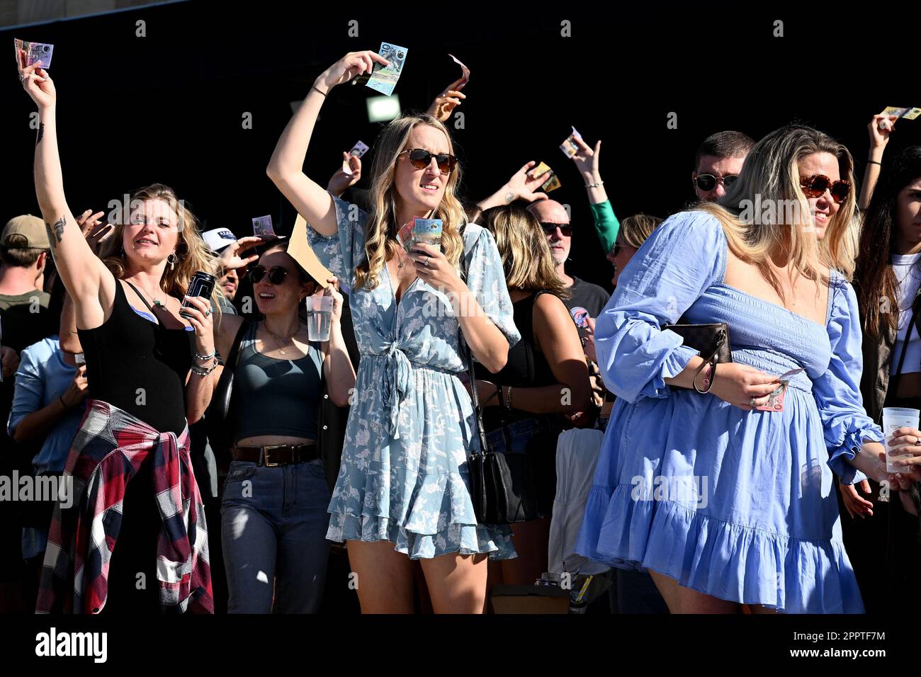 A large crowd is seen playing TwoUp during ANZAC Day at Harbord