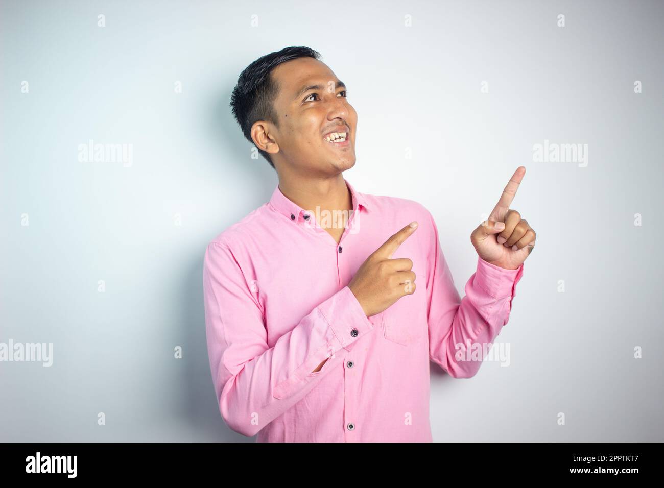 Man wearing pink shirt hi-res stock photography and images - Alamy
