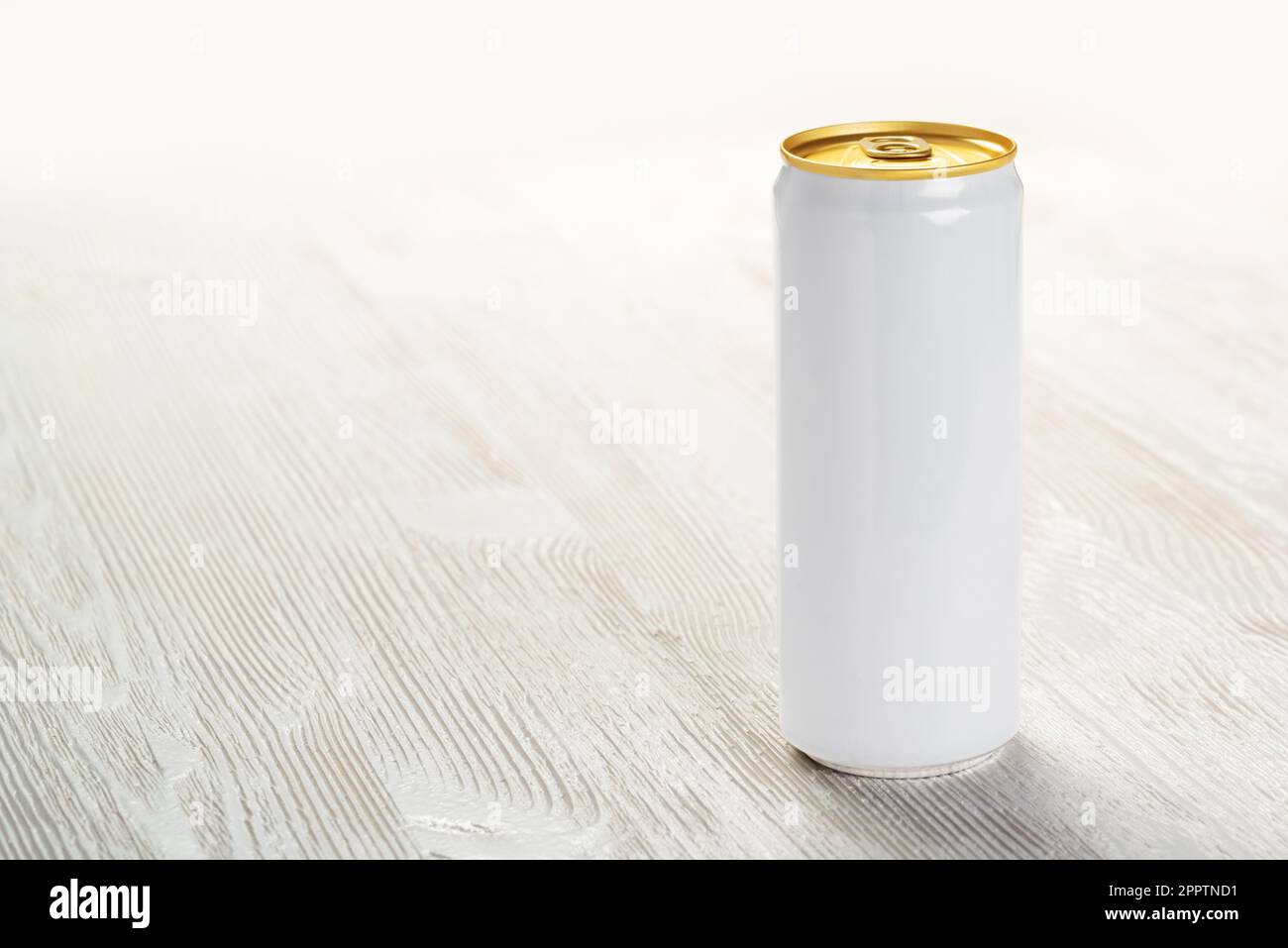 Aluminum 330 ml slim can on the white wood table. Mock-up for design drink, beer, soda, juice, water or alcohol. Stock Photo
