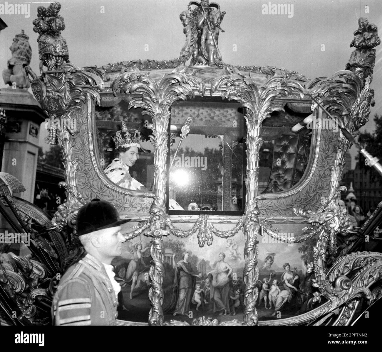 File photo dated 02/06/53 of Queen Elizabeth II smiling in the Royal State Coach leaving Westminster Abbey for Buckingham Palace after the Coronation. The 1953 coronation was a morale boost in the tough post-war years as millions celebrated the historic day. Elizabeth II was crowned in a deeply religious ceremony in Westminster Abbey on June 2 1953. Issue date: Tuesday April 25, 2023. Stock Photo