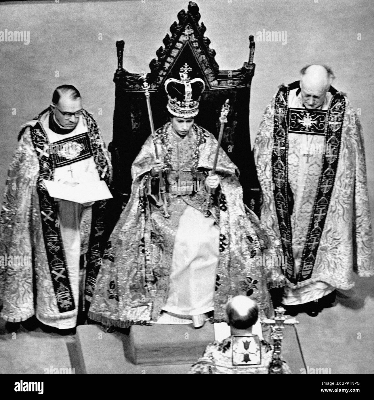 File photo dated 02/06/53 of Queen Elizabeth II wearing the St. Edward Crown and carrying the Sceptre and the Rod after her Coronation in Westminster Abbey, London. The 1953 coronation was a morale boost in the tough post-war years as millions celebrated the historic day. Elizabeth II was crowned in a deeply religious ceremony in Westminster Abbey on June 2 1953. Issue date: Tuesday April 25, 2023. Stock Photo