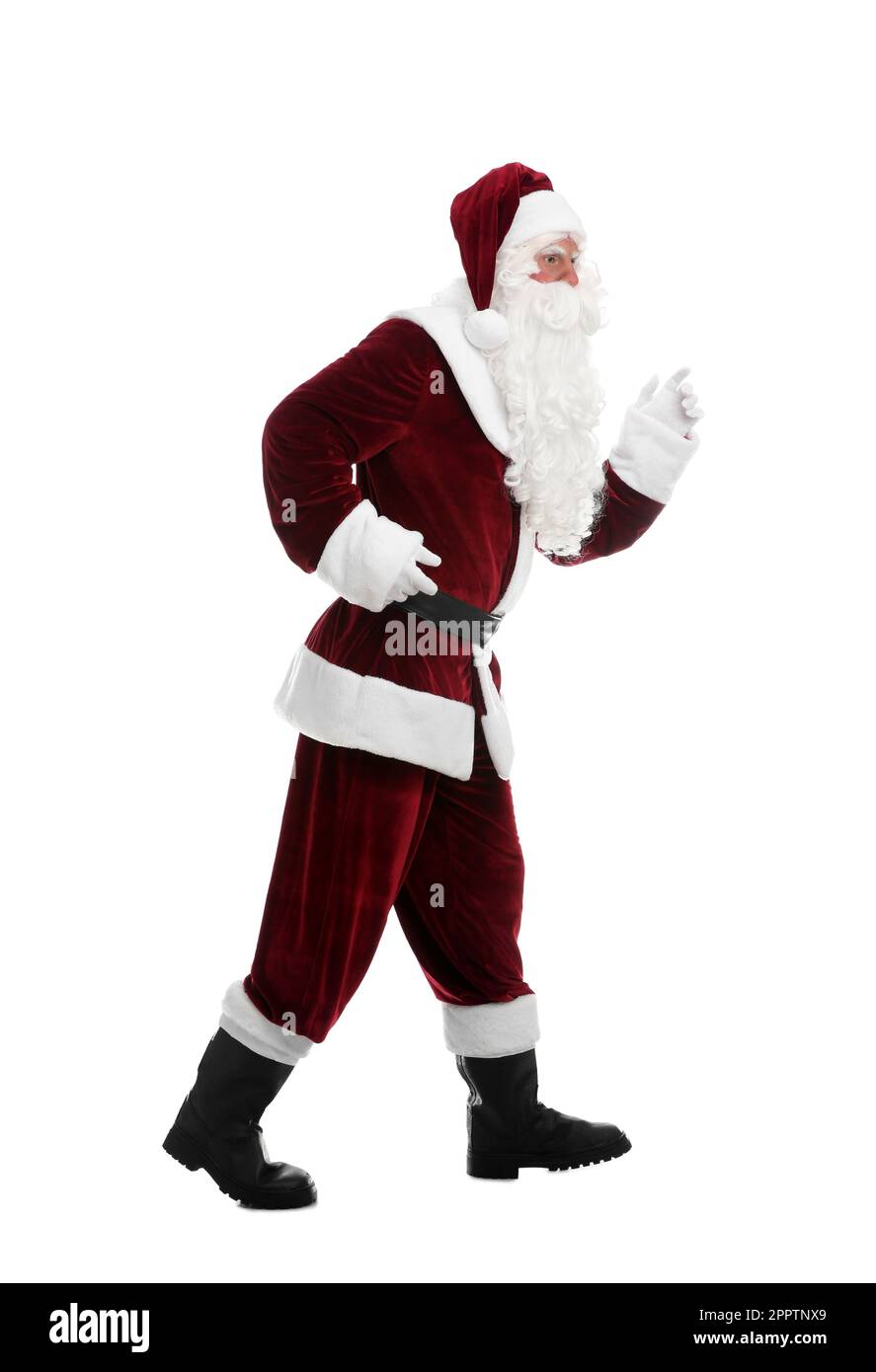 Full length portrait of Santa Claus walking on white background Stock Photo