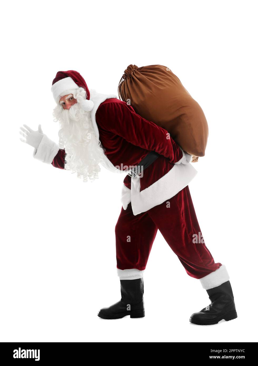 Santa Claus with sack walking on white background Stock Photo - Alamy