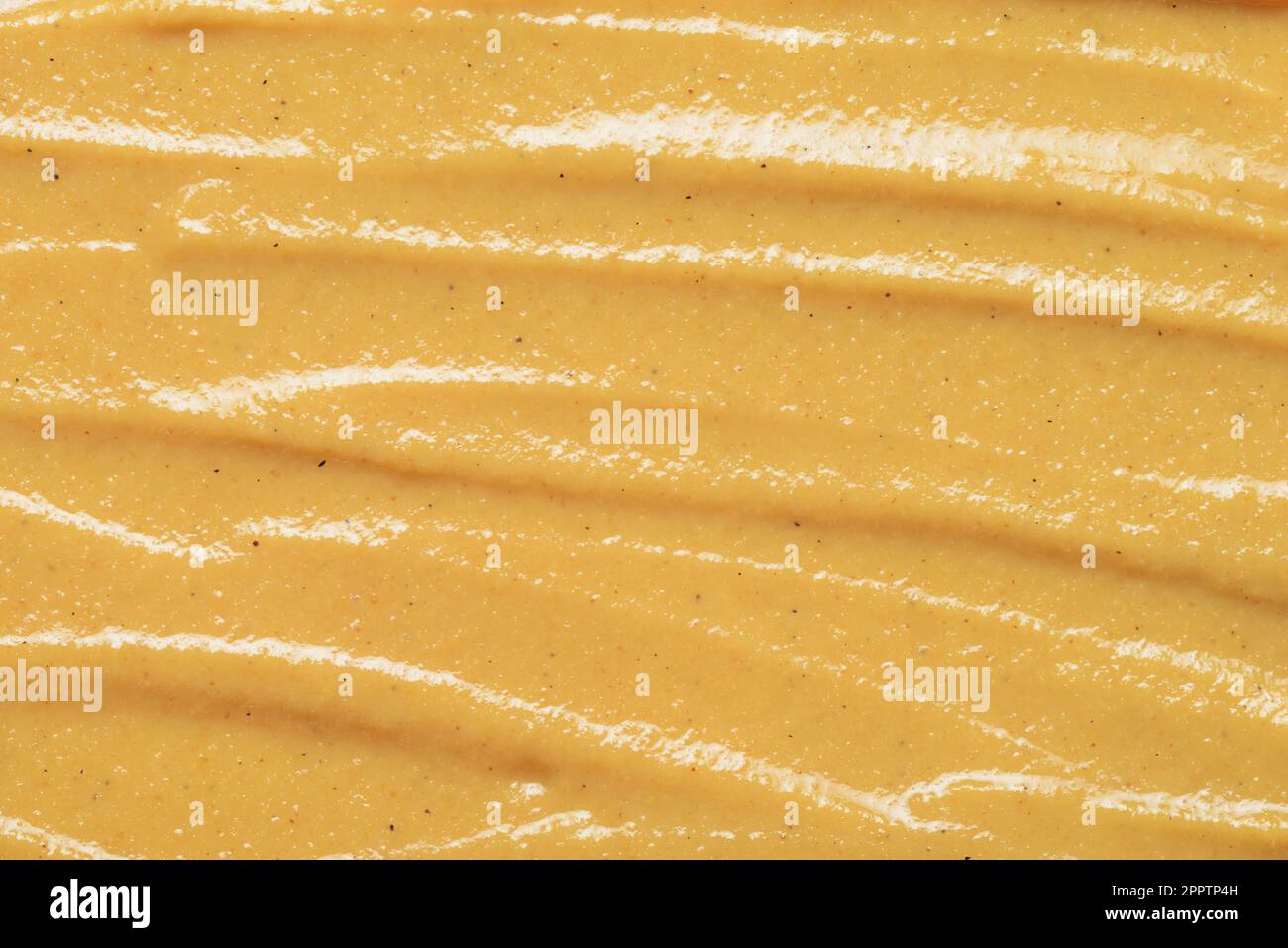 Yellow mustard sauce ketchup texture background close up Stock Photo