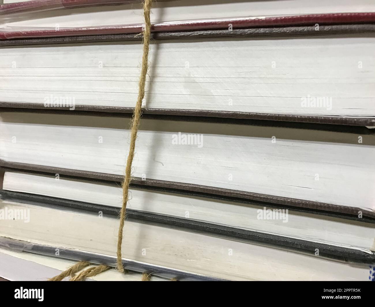 Wallpaper Ropes Book Pile of old books with rope background Stock Photo - Alamy