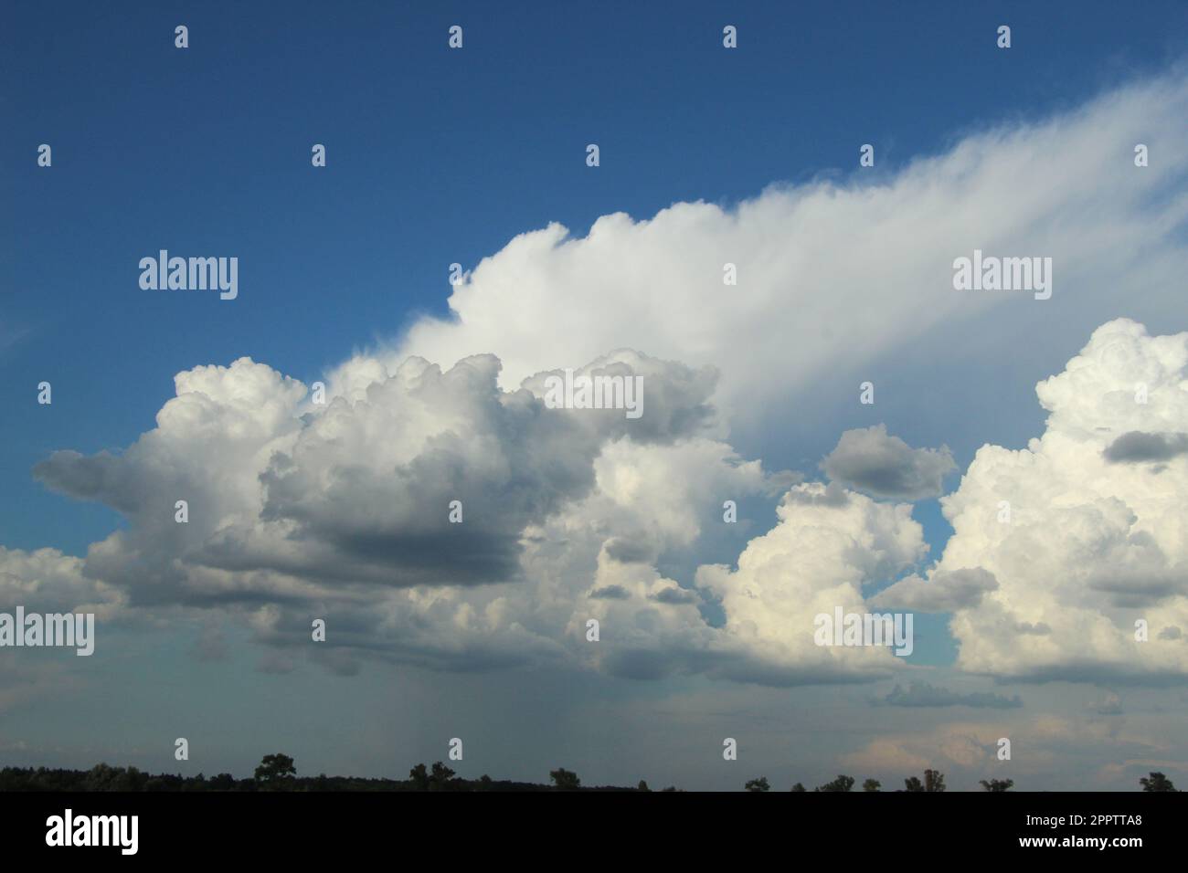 White fluffy clouds in the blue sky Stock Photo