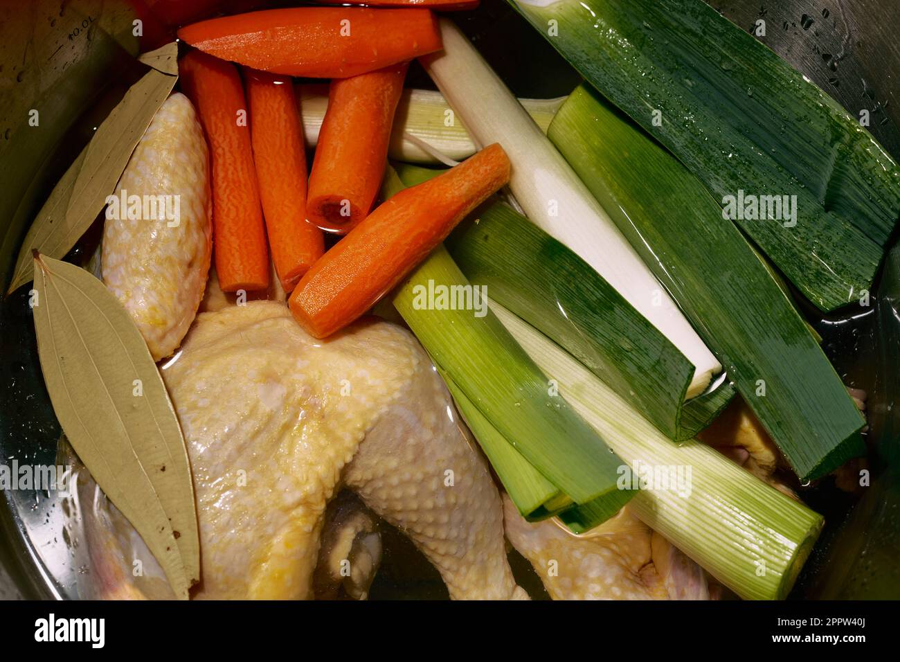 Close up vegetables and chicken cooking in pot Stock Photo - Alamy