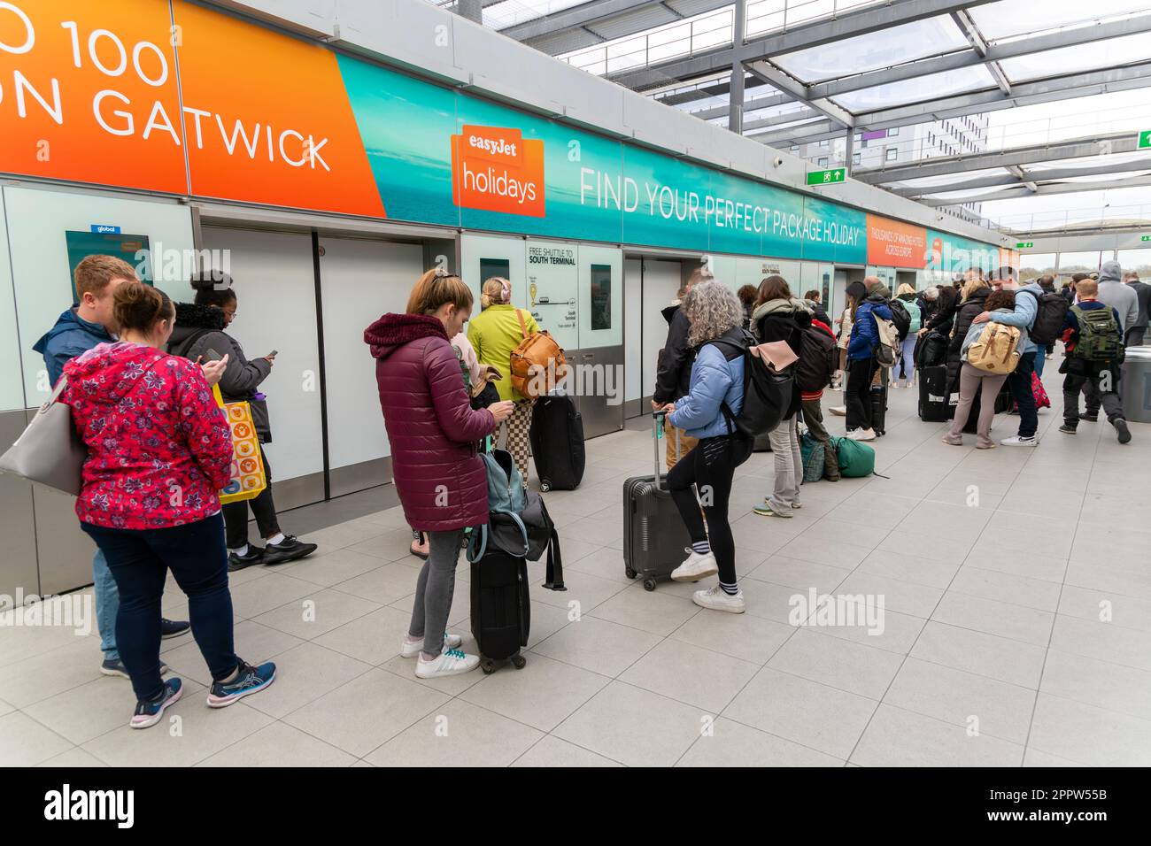 Passengers waiting for free shuttle train at North Terminal, London