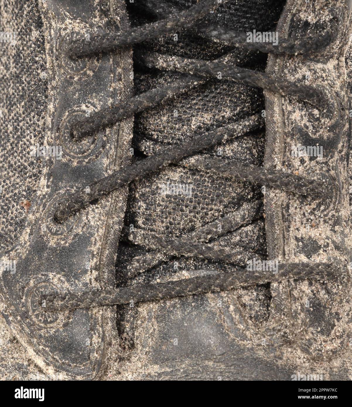 Black shoe, covered in mud, isolated on white Stock Photo - Alamy