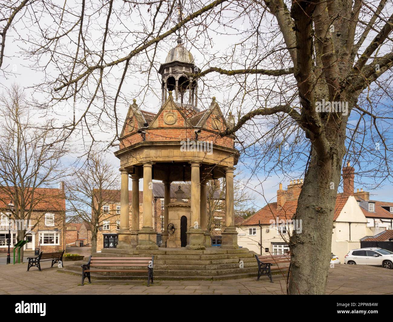 Market Well, grade II listed water well situated in St James Square in Boroughbridge, North Yorkshire, UK Stock Photo