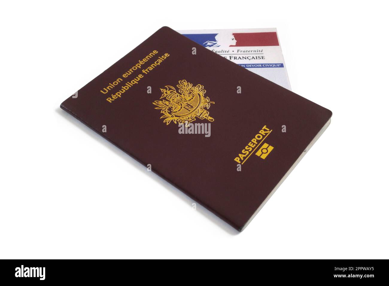 Paris, France - September 25 2016: French biometric passport and a French electoral voting card isolated on white. In order to vote, a french expat mu Stock Photo