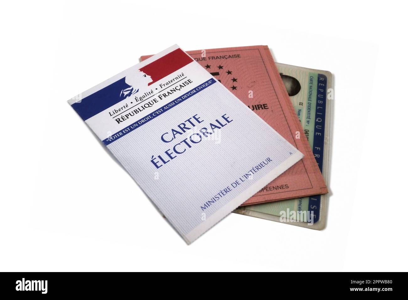 Paris, France - September 2016: Close up of an electoral card, driver's license and ID card isolated on white background. Stock Photo